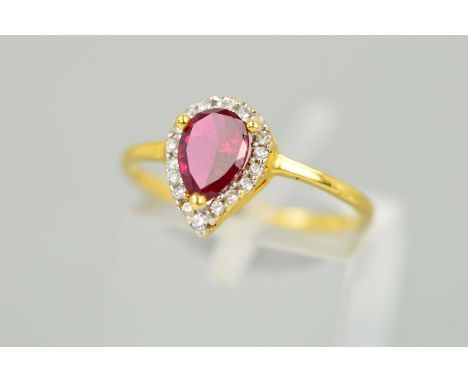 A MODERN SYNTHETIC RUBY AND CUBIC ZIRCONIA PEAR SHAPE CLUSTER RING, ring size K1/2, stamped '916', approximate gross weight 1