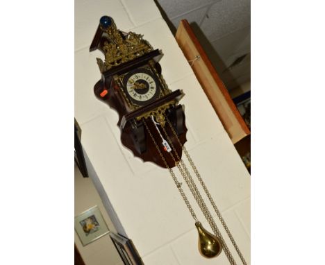A DUTCH WALL CLOCK, with Roman numeral dial and brass motifs, with weights (some damage to wood at the bottom)