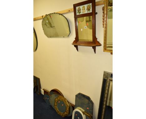 AN EDWARDIAN OAK WALL MIRROR/SHELF with ceramic plaque above, together with various brass framed wall mirrors and seven other