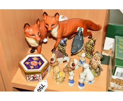 A GROUP OF CERAMIC ORNAMENTS, to include Royal Crown Derby covered trinket pot A1298 pattern, two Beswick Foxes No1016A (both