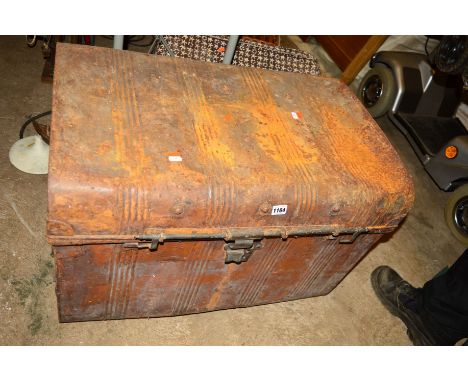 A VINTAGE TIN TRUNK