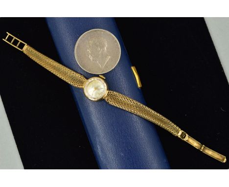 A 9CT GOLD LADYS TISSOT WRISTWATCH AND A GEORGE IV COIN, the watch with a circular face and baton hour markers to the mesh st