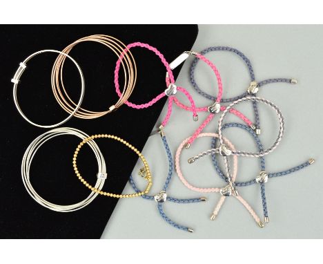 ELEVEN MOLLY BROWN BRACELETS AND BANGLES to include seven plaited cord bracelets with silver panels, two five row silver bang