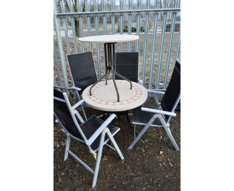 A CIRCULAR PLASTIC GARDEN TABLE with tile top design, another similar table, together with four plastic foldable chairs (6)