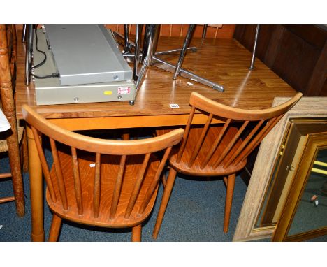 A MODERN DINING TABLE and four beech stick back chairs (5)