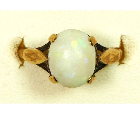 A 9ct gold and cabochon opal single stone ring, 10 x 8mm, L, 2.2gm 