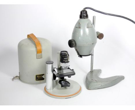 A Mecopta, Czechoslovakia microscope, serial number 856912, metal construction with 10x optic, metal carry case with leather 