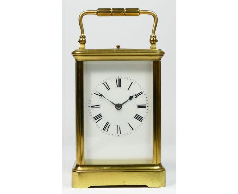 A French brass striking and repeating carriage clock, white enamel dial with Roman numerals, the Paris made movement striking