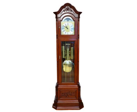 A 20th century carved and pierced hardwood musical longcase clock, the silvered chapter ring with Roman numerals, the German 