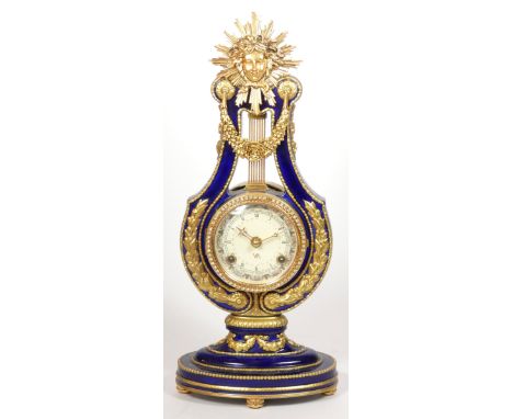 Franklin Mint for the V &amp; A Museum, a cobalt blue and gilt Marie Antoinette 18th century style lyre mantle clock, the 8cm