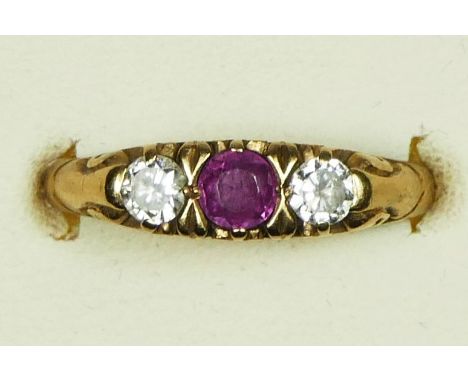 A 9ct gold Edwardian style ruby and diamond three stone Ring, carved claw set with brilliant cut stones of approximately 0.15