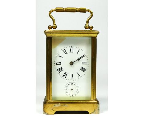 A brass alarm carriage clock, the white enamel dial lacking minute and alarm hands, the movement striking on a bell, 11.5 x 8