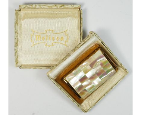 Melissa, a gilt metal and mother of pearl musical ladies compact, 7.5 x 5 x 1.5cm, instructions, pouch and box, overwound. 
