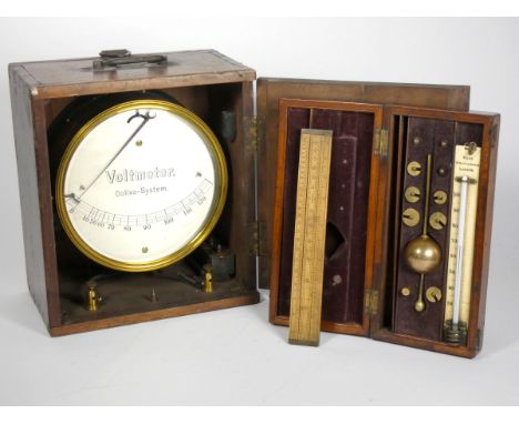 A Sikes hydrometer, brass, with brass weights, in a mahogany case with fitted interior, including Buss thermomter and a J. Lo