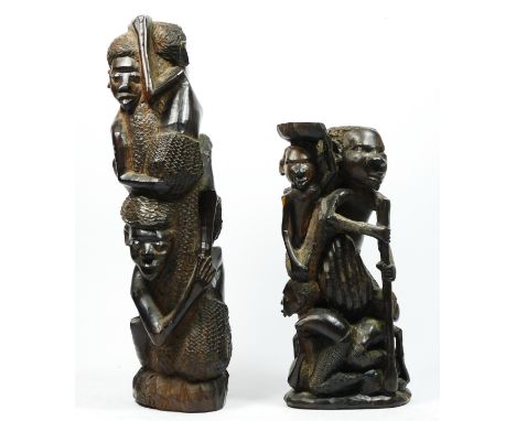 A West African carved hardwood figure group of four men climbing a tree trunk, 33cm and another of a man with five children, 