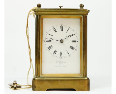 T. Martin & Co., London & Paris, a late 19th century brass striking carriage clock, the white enamel dial with Roman numerals