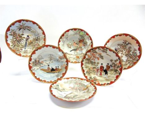 A SET OF TWELVE KUTANI SHALLOW BOWLS,  each with painted enamel decoration highlighted in gilt, three depicting birds amongst