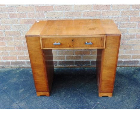 A HEALS WALNUT KNEEHOLE DESK,  the single frieze drawer with chrome handles and ivorine plaque for 'Heals, Tottenham Court Ro