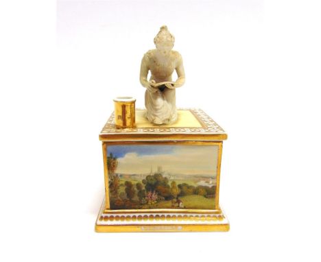 AN EARLY 19TH CENTURY CHAMBERLAINS WORCESTER INKWELL,  the front with a named painted view of Worcester, the lid modelled wit