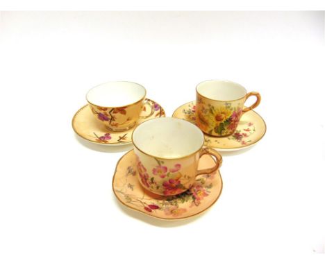 THREE ROYAL WORCESTER CABINET CUPS AND SAUCERS:  one with floral decoration, date code for 1919; together with another decora