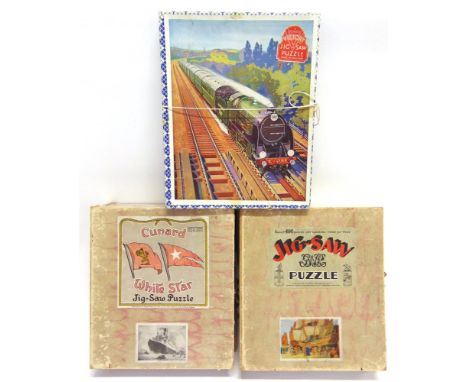 THREE WOODEN JIGSAW PUZZLES comprising a Cunard 'R.M.S. Andania' by Chad Valley, boxed; Great Western Railway 'Drake Goes Wes