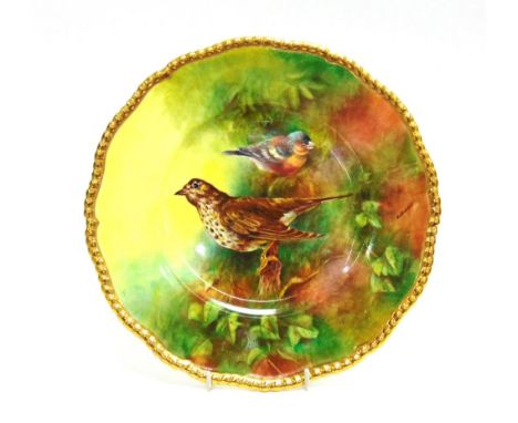 A CABINET PLATE WITH PAINTED BIRD DECORATION  signed 'R Budd', for Richard Budd, within gilt border, 27cm diameter