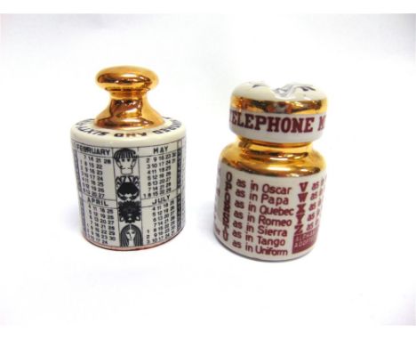 TWO FORNASETTI PAPERWEIGHTS: a 1965 calendar paperweight, and a NATO phonetic alphabet ceramic insulator paperweight, each ap