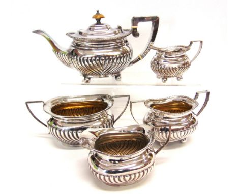 A SILVER CREAM JUG AND SUGAR BASIN by W. Atkin, Birmingham 1912, of oval gadrooned form, 383g (12.3 troy ozs) gross, offered 