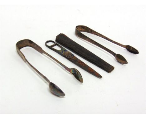 A PAIR OF STEEL SCISSORS WITH ENAMEL HANDLE leather case, 19th century; with two silver sugar tongs 