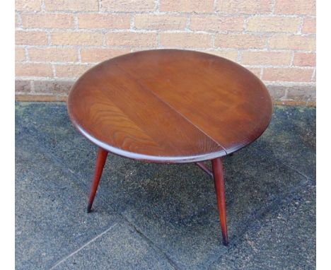 AN ERCOL DROP-LEAF OCCASIONAL TABLE,  61cm diameter 40cm high; and a set of four stickback Ercol chairs (5)