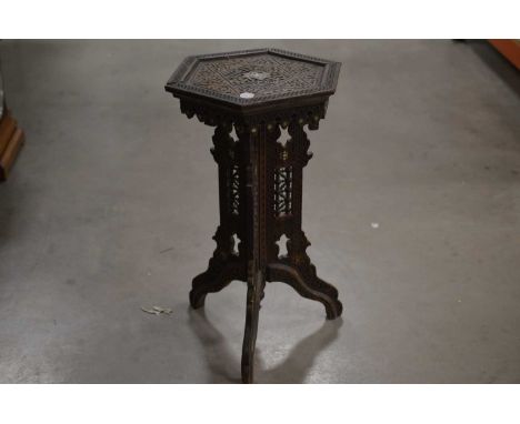 An octagonal lamp table, with Ottoman style carving and shell inlays.