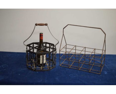 Two vintage steel French château or country house cellar winebottle carriers, one for five bottles with a wooden handle, the 