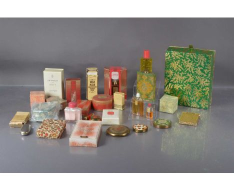A collection of vintage perfume bottles, mostly COTY examples, some with contents and mostly boxed, together with some compac