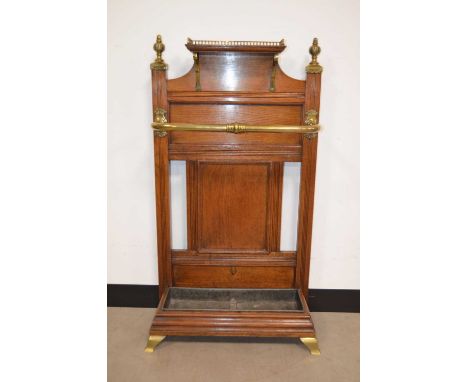 A late Victorian oak and brass hall umbrella or stick-stand by James Shoolbred & Co,  marked with brass registration plaque t