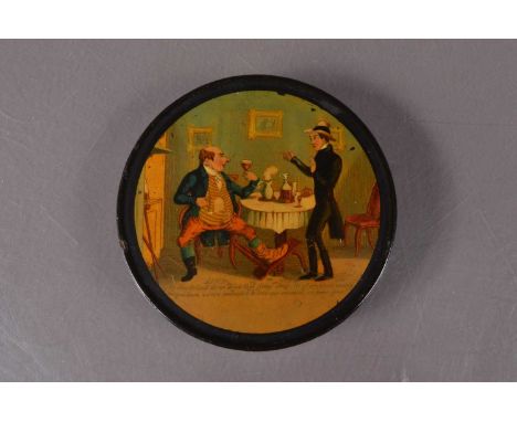 A 19th century papier mache snuff box, of circular form with transfer printed pull off lid with an inscription of a Man urgin