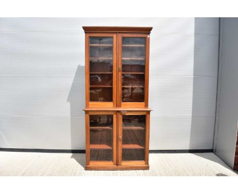A large Victorian Double Glazed Bookcase, having five shelves to the top, and three to the lower section, 208cm H x 99.5cm W.