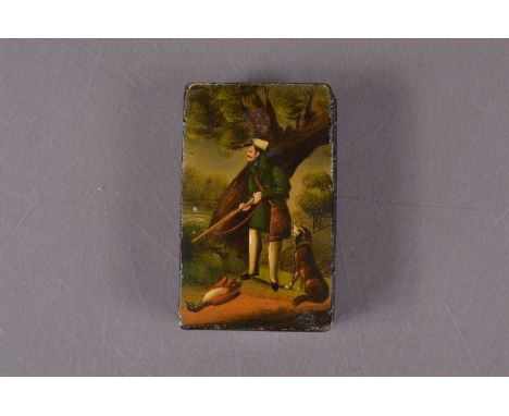 A 19th century  papier mache snuff box, of rectangular form with transfer printed, hinged lid of a hunter standing over a dea