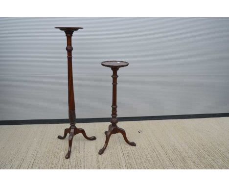 Two early 20th Century mahogany torcheres or lamp tables, each with turned carved pedestals etc. The tallest 127cm high