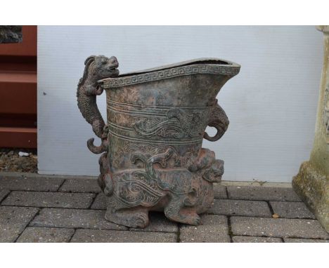 A verdigris bronze planter, in the form of a Chinese archaistic vessel. 32 cm high.