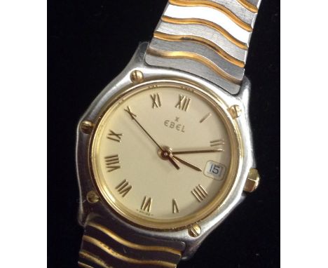Ebel - a lady's stainless steel and gold plated centre seconds quartz bracelet watch Ref 183908, cream dial, Roman numerals, 