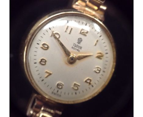 Tudor Rolex - a lady's 9ct gold wrist watch, silvered dial, Arabic numerals, minute track, seventeen jewel manual wind moveme