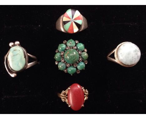 Rings - a silver turquoise, mother of pearl, coral and jet twelve panel sunburst ring, silver shank, size O;  an oval red cor