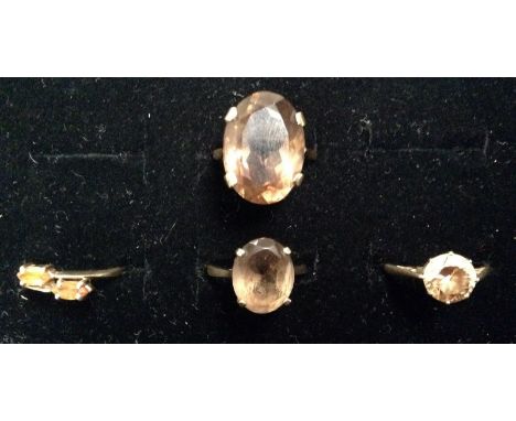 Rings - a large oval smoky quartz dress ring, size O;  another smaller, size M;  others, assorted sizes, all 9ct gold shanks,