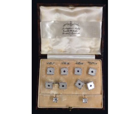 A gentleman's Art Deco eight piece dress shirt suite, comprising a pair of sapphire paste and mother of pearl square panel ch