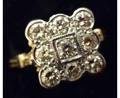 A nine stone diamond ring, nine round brilliant cut diamonds, each approx 0.15ct, arranged in a square platform with central 