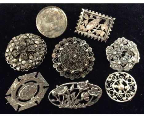 Jewellery - a Victorian silver rectangular panel brooch, pierced and engraved with a bird amongst foliage, unmarked;  an Aest