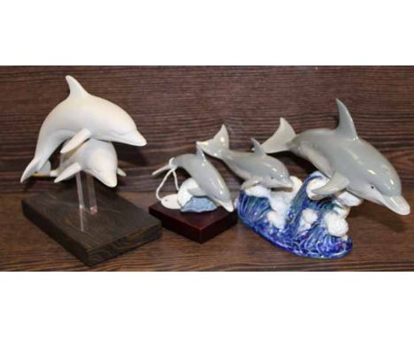 THREE LLADRO DOLPHINS 
comprising two groups and a single dolphin 