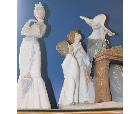LARGE LLADRO FIGURE GROUP
of a nun at a keyboard teaching two children, with green velvet topped display plinth; together wit