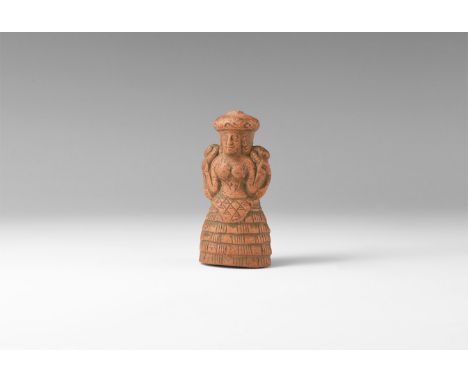 20th century AD. A ceramic miniature figurine of the Minoan Snake Goddess with flounced skirt, domed headdress, snake to each