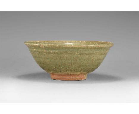 Ming Dynasty, 1368-1644 AD. A ceramic bowl with basal ring and flared rim, green glaze to upper body.  440 grams, 16cm (6 1/4